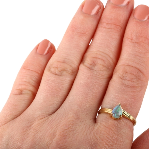 1477 - A modern 14ct gold solitaire opal ring, claw set with pear cabochon opal, opal measures approx 6.84 ... 