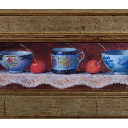 540 - Maimie Gerrard, still life, china and cherries, oil on board, signed, 8cm x 29cm, framed