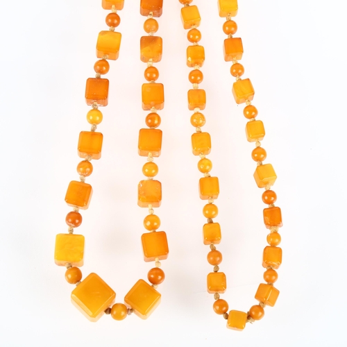 1529 - A single-strand graduated butterscotch amber cube bead necklace, beads measure: 13.9-7.2mm, 88cm, 41... 