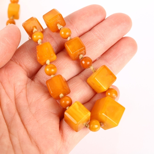 1529 - A single-strand graduated butterscotch amber cube bead necklace, beads measure: 13.9-7.2mm, 88cm, 41... 