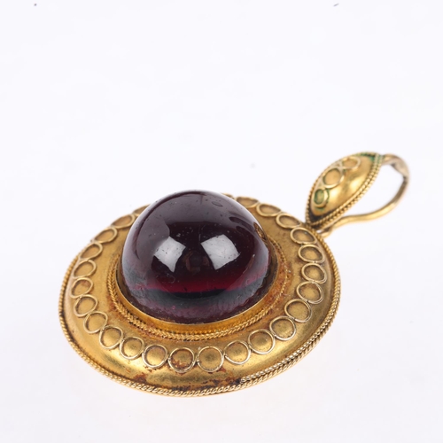 1155 - A Victorian Etruscan Revival garnet mourning locket pendant, circa 1880, centrally set with foil-bac... 