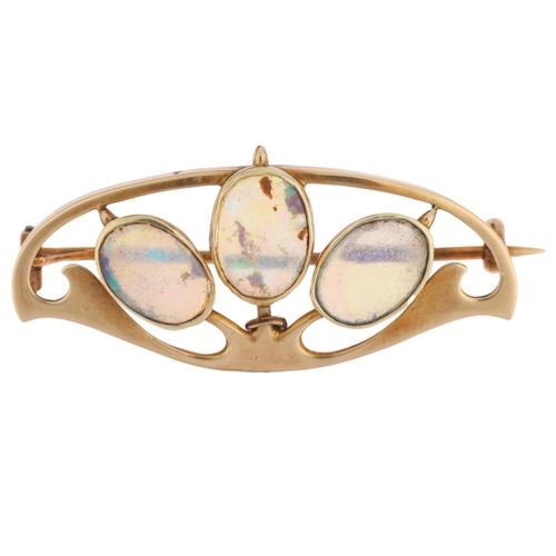 1157 - MURRLE BENNETT - an Art Nouveau 15ct gold opal openwork brooch, circa 1905, rub-over set with oval f... 