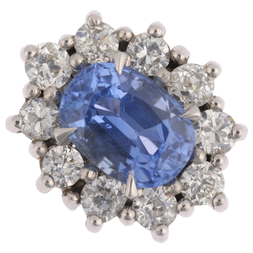 1162 - A Sri Lankan 'No Heat' sapphire and diamond oval cluster ring, centrally claw set with 2.44ct oval m... 