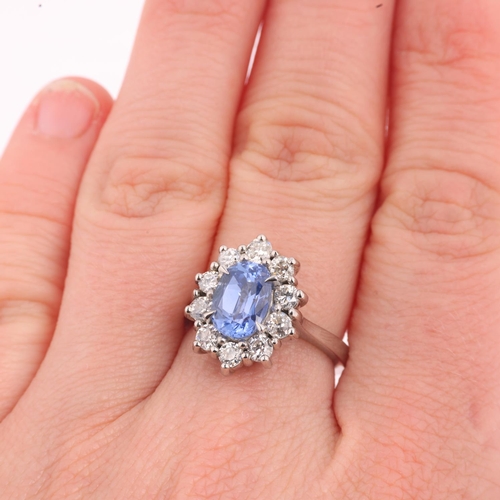 1162 - A Sri Lankan 'No Heat' sapphire and diamond oval cluster ring, centrally claw set with 2.44ct oval m... 