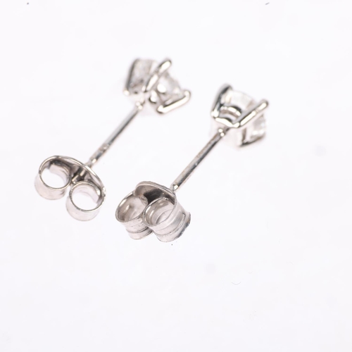 1165 - A pair of 18ct white gold 1.01ct solitaire diamond stud earrings, each claw set with individually ce... 