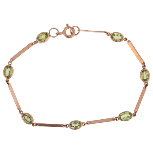 1167 - A 9ct rose gold peridot tennis line bracelet, maker SA, London 2011, rub-over set with oval mixed-cu... 