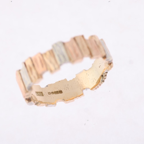 1171 - A 1980s 9ct three-colour gold abstract band ring, maker LWJ, Sheffield 1984, textured bark offset bl... 