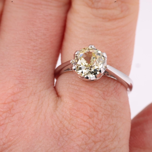 1172 - An 18ct white gold 1.9ct solitaire diamond ring, claw set with 1.9ct light yellow old-cut diamond, c... 