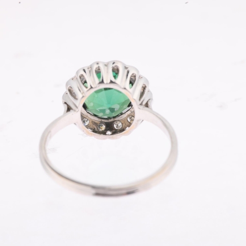 1180 - An 18ct white gold green tourmaline and diamond flowerhead cluster ring, centrally claw set with 3ct... 