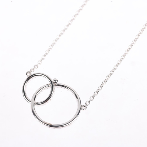 1183 - A modern 18ct white gold diamond double-hoop pendant necklace, LD Ltd modelled as 2 interlocking gra... 