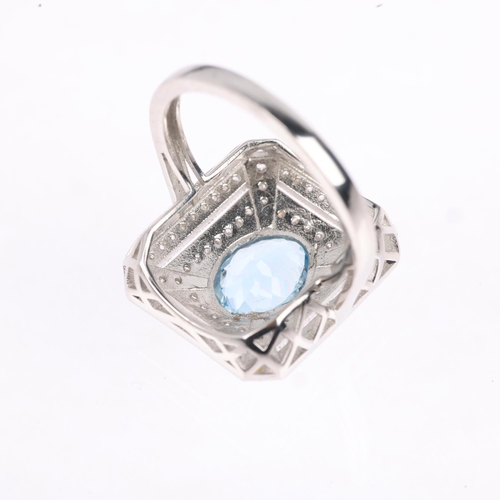 1184 - A platinum aquamarine and diamond panel ring, in the Art Deco style, rub-over set with 1.25ct oval m... 