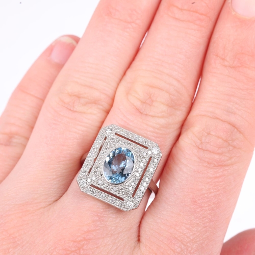 1184 - A platinum aquamarine and diamond panel ring, in the Art Deco style, rub-over set with 1.25ct oval m... 