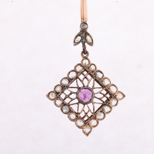 1191 - A fine Edwardian ruby and diamond openwork drop pendant necklace, the square flowerhead pierced drop... 