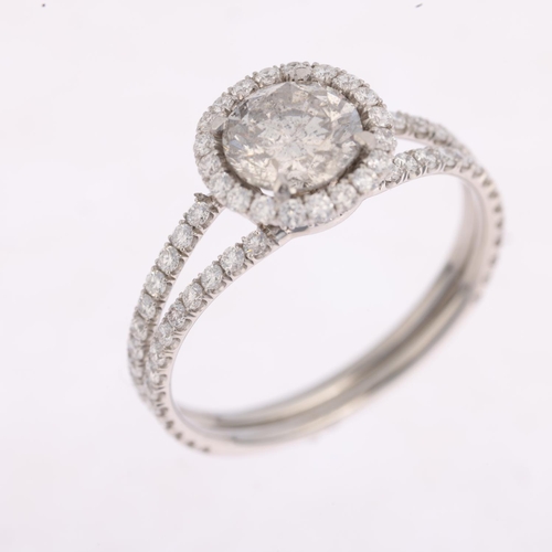 1193 - A modern diamond halo cluster ring, centrally set with 1ct modern round brilliant-cut diamond surrou... 