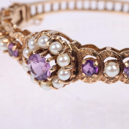 1194 - A late 20th century 9ct gold amethyst and pearl cluster hinged bangle, no maker's mark of date lette... 