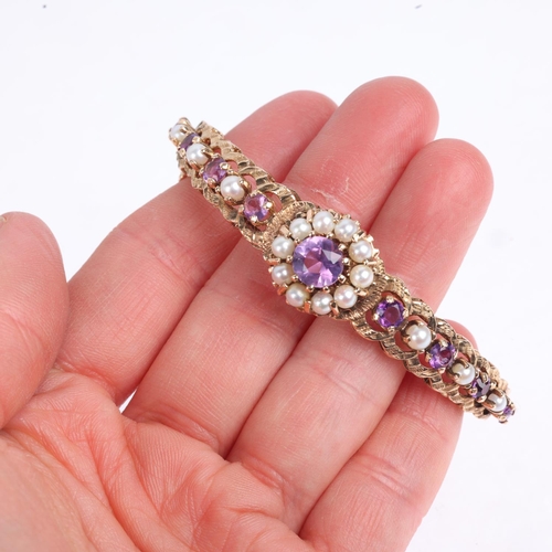 1194 - A late 20th century 9ct gold amethyst and pearl cluster hinged bangle, no maker's mark of date lette... 