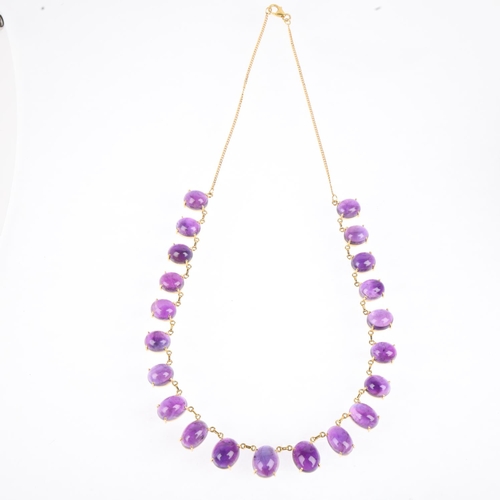 1195 - A 22ct gold graduated amethyst fringe necklace, claw set with oval cabochon amethysts, largest measu... 