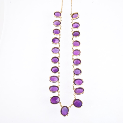 1195 - A 22ct gold graduated amethyst fringe necklace, claw set with oval cabochon amethysts, largest measu... 