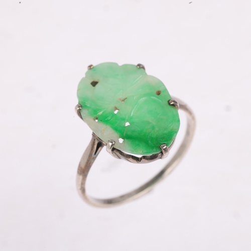 1196 - An Art Deco carved jade floral panel ring, apparently unmarked, setting height 19mm, size Q, 2.3g