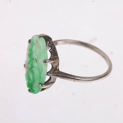 1196 - An Art Deco carved jade floral panel ring, apparently unmarked, setting height 19mm, size Q, 2.3g