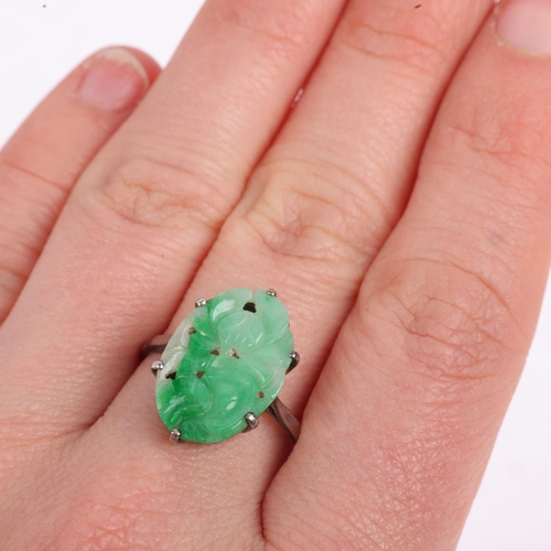 1196 - An Art Deco carved jade floral panel ring, apparently unmarked, setting height 19mm, size Q, 2.3g