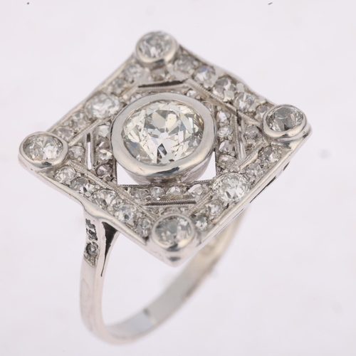 1205 - An Art Deco platinum diamond geometric panel ring, centrally set with 1.15ct old European-cut diamon... 