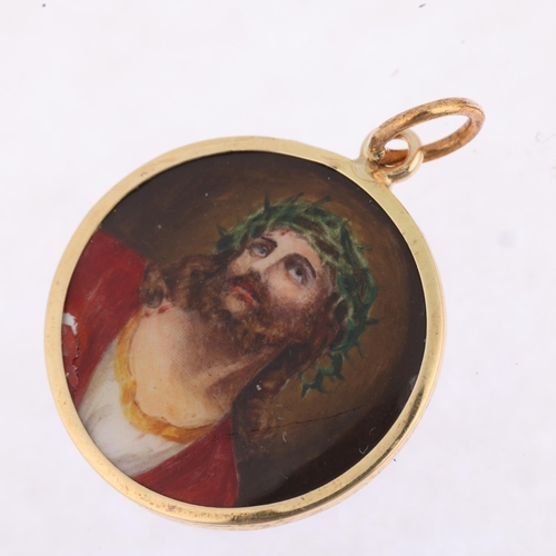 1206 - A Vintage enamel 'Jesus Christ' pendant, hand painted decoration with engine turned sunburst guilloc... 