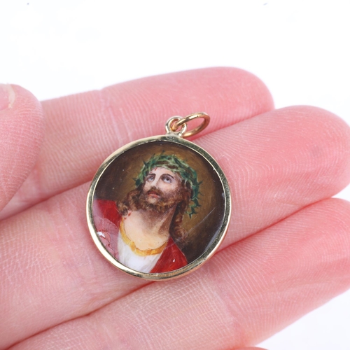 1206 - A Vintage enamel 'Jesus Christ' pendant, hand painted decoration with engine turned sunburst guilloc... 