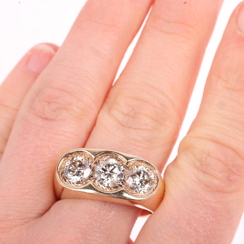 1213 - A large 9ct gold three stone diamond gypsy ring, set with modern round brilliant-cut diamonds, each ... 