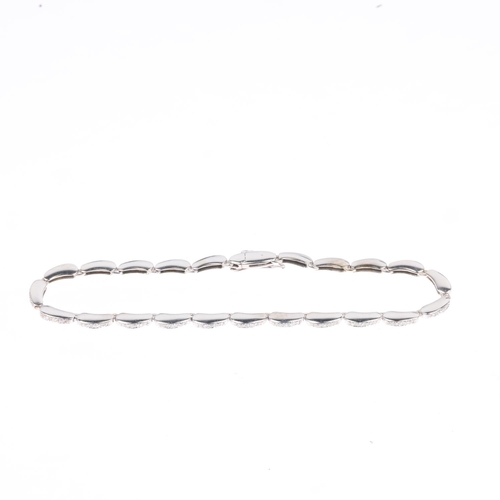 1219 - An 18ct white gold diamond tennis line bracelet, pave set with modern round brilliant-cut diamonds, ... 