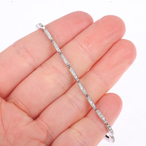 1219 - An 18ct white gold diamond tennis line bracelet, pave set with modern round brilliant-cut diamonds, ... 