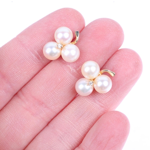 1223 - A pair of 14ct gold whole pearl and diamond clover earrings, with stud fittings, 15.2mm, 3.8g