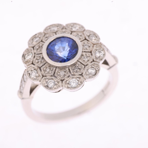 1228 - A platinum sapphire and diamond flowerhead cluster ring, maker JC, set with 1ct round-cut sapphire s... 