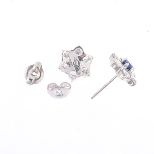 1229 - A pair of 18ct white gold sapphire and diamond flowerhead cluster earrings, claw set with round-cut ... 