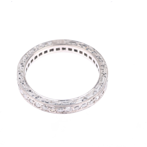 1239 - An Art Deco 18ct white gold diamond full eternity band ring, millegrain set with eight-cut diamonds ... 