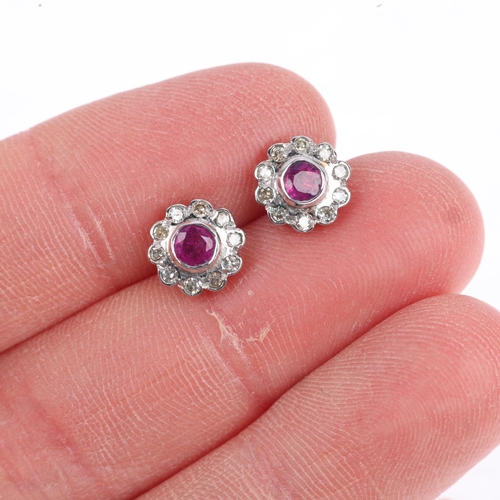 1242 - A pair of ruby and diamond flowerhead cluster earrings, with stud fittings, apparently unmarked, 8.1... 