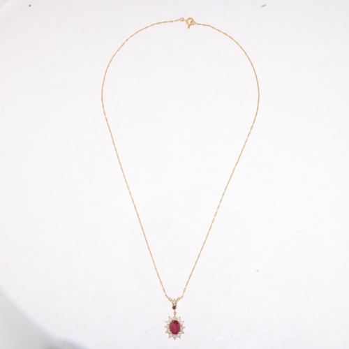 1244 - A French 18ct gold ruby and diamond flowerhead cluster pendant necklace, on 18ct fancy link chain, t... 