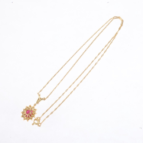 1244 - A French 18ct gold ruby and diamond flowerhead cluster pendant necklace, on 18ct fancy link chain, t... 