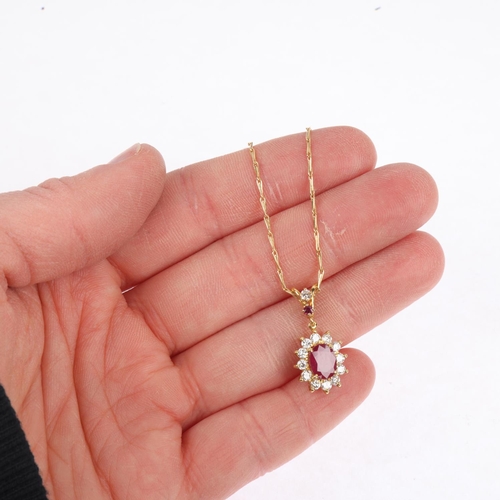 1244 - A French 18ct gold ruby and diamond flowerhead cluster pendant necklace, on 18ct fancy link chain, t... 