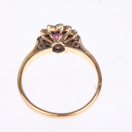 1245 - An 18ct gold ruby and diamond flowerhead cluster ring, claw set with oval mixed-cut ruby and modern ... 