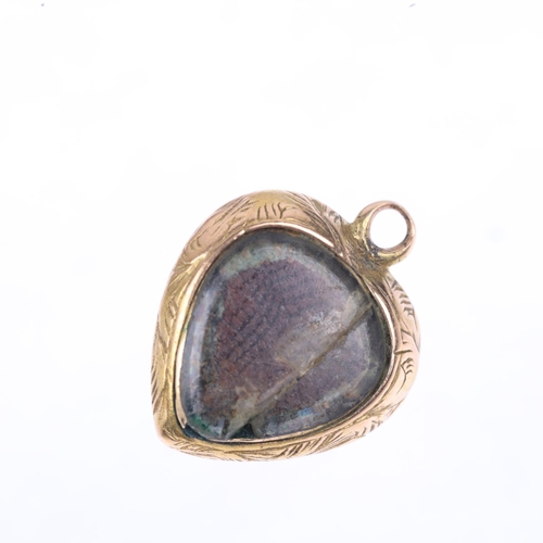 1253 - A Victorian garnet heart mourning locket pendant, rub-over set with oval cabochon garnet, with folia... 