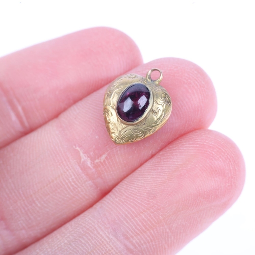 1253 - A Victorian garnet heart mourning locket pendant, rub-over set with oval cabochon garnet, with folia... 