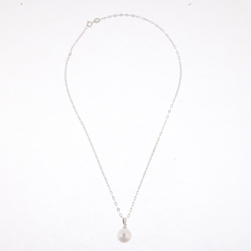 1261 - A modern 14ct white gold whole pearl and diamond pendant necklace, on 14ct cable link chain, set wit... 