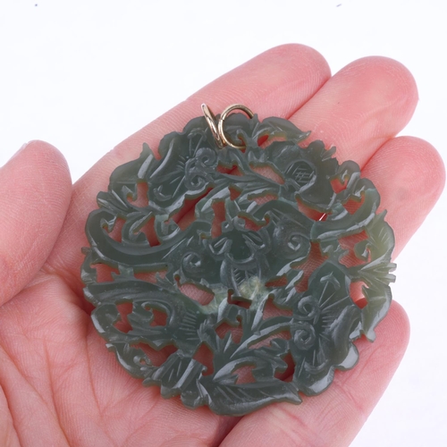 1265 - A Chinese jade 'Bat' disc pendant, carved and pierced decoration, 52.4mm, 13g