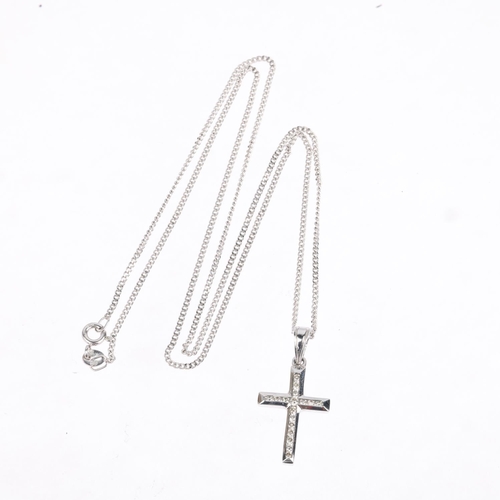 1274 - A modern 9ct white gold diamond cross pendant necklace, on 9ct fine curb link chain, total diamond c... 