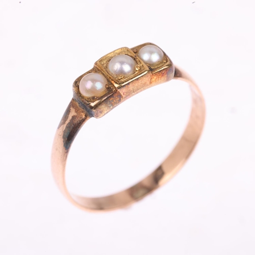 1277 - A Victorian three stone pearl mourning ring, apparently unmarked, closed-back settings, setting heig... 