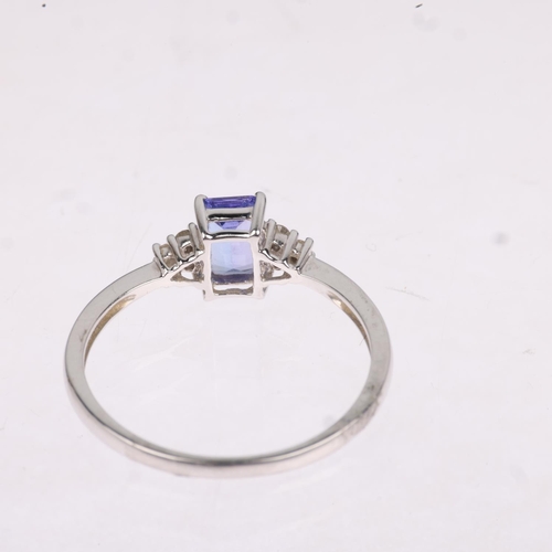 1282 - A modern 18ct white gold tanzanite and diamond dress ring, setting height 6.4mm, size M, 1.6g