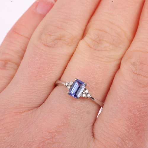 1282 - A modern 18ct white gold tanzanite and diamond dress ring, setting height 6.4mm, size M, 1.6g