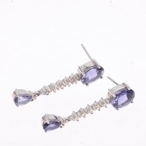 1283 - A pair of 9ct white gold tanzanite and diamond drop earrings, with stud fittings, 29.6mm, 4.1g