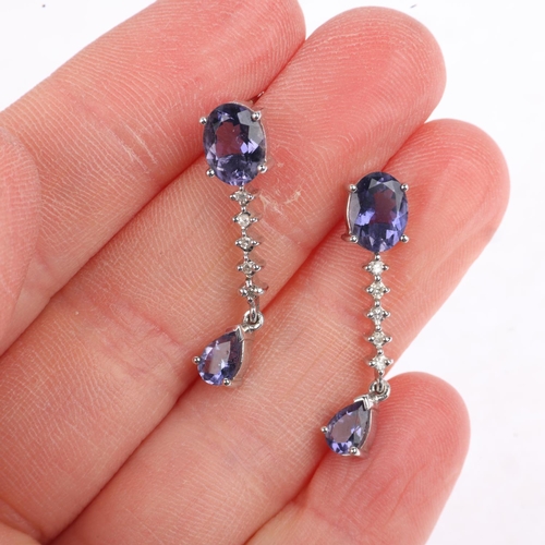 1283 - A pair of 9ct white gold tanzanite and diamond drop earrings, with stud fittings, 29.6mm, 4.1g